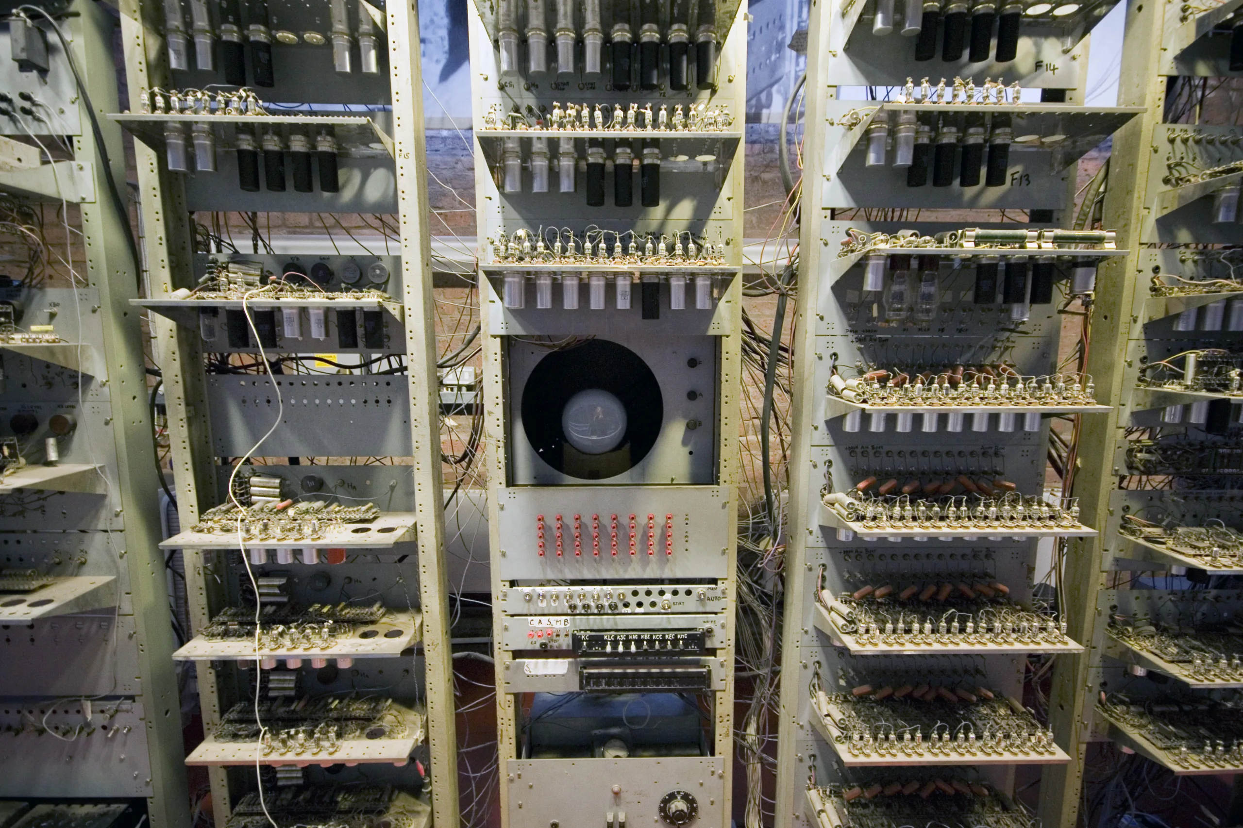 The output CRT is immediately above the input device, flanked by the monitor and control electronics.